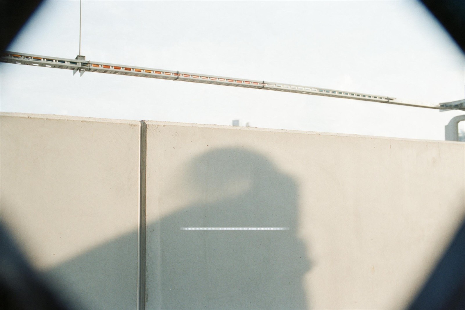 View through the glasses: a concrete wall with one line of text in the lens